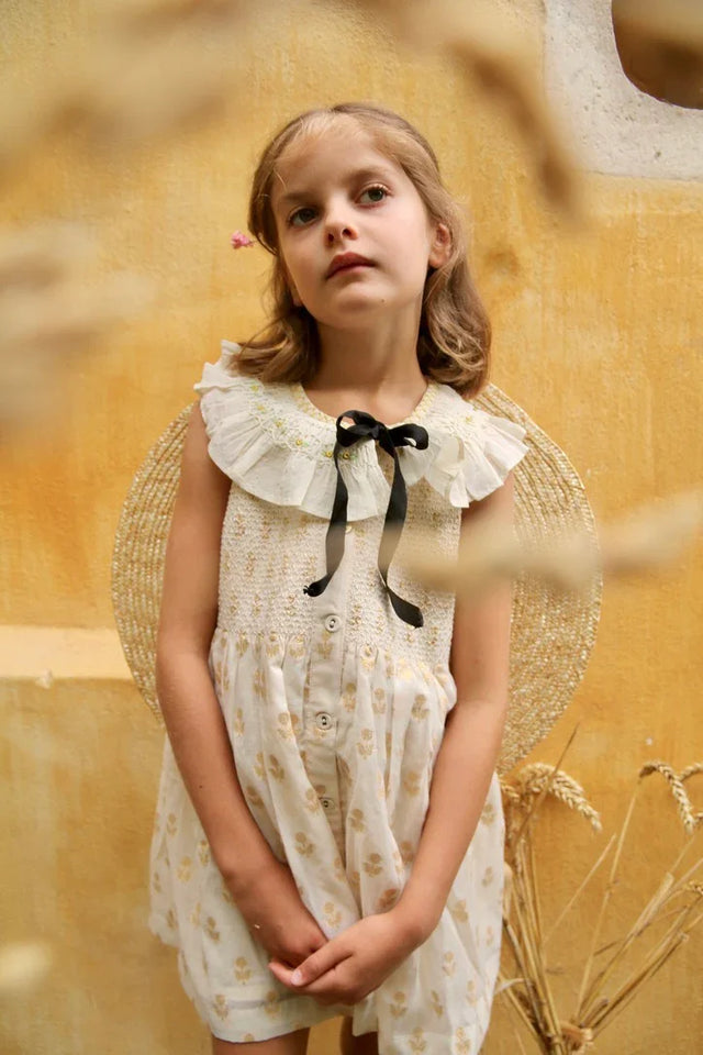 American armhole tunic and its bow barrette