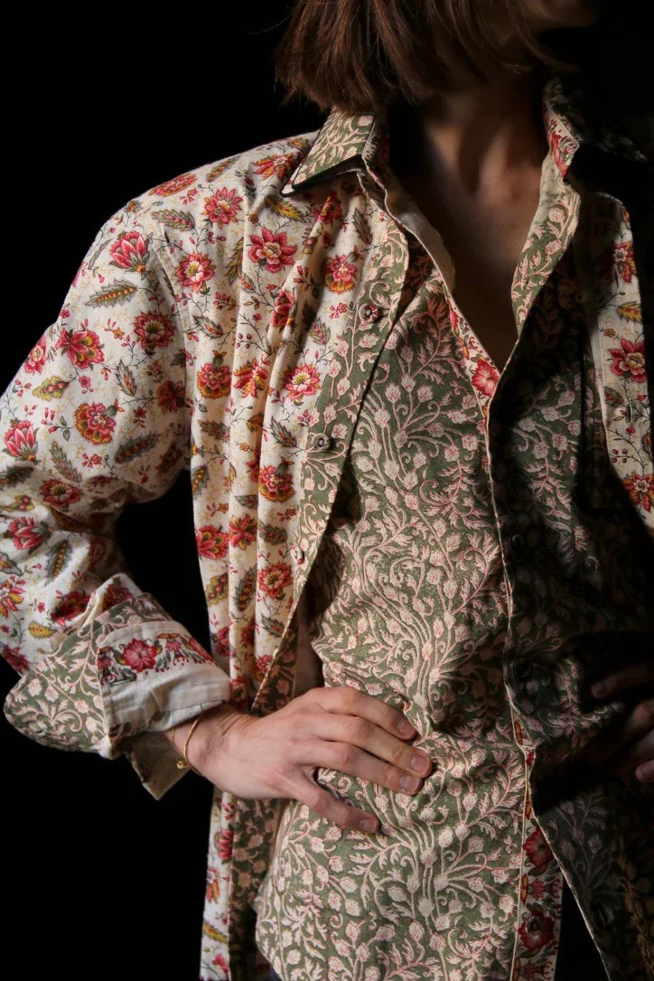 Woman wearing floral print shirts with vintage-inspired patterns in soft colors