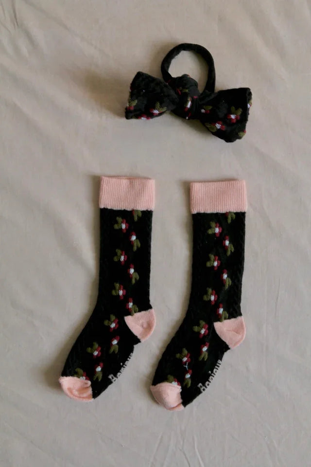 Chaussettes farandole de fleurs noire et son élastique noeud pour les cheveux