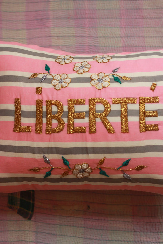 Striped pink cushion with gold embroidered 'LIBERTÉ' and floral design, home decor textile