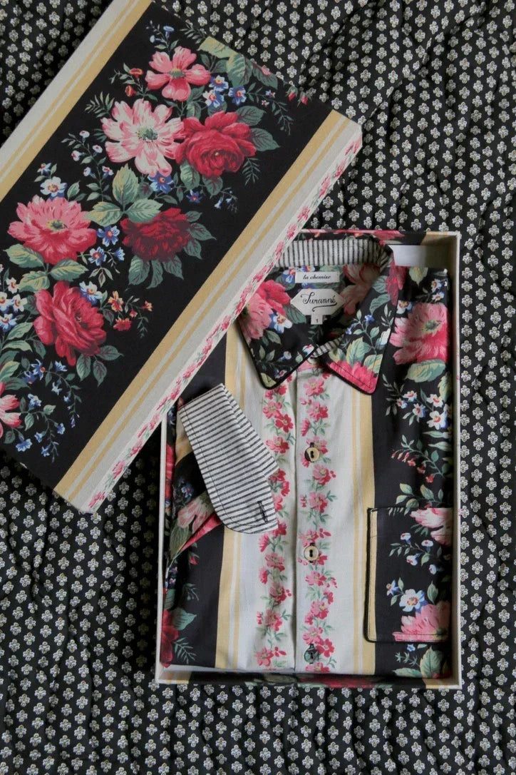 Floral print cotton pajama set in gift box on patterned fabric background