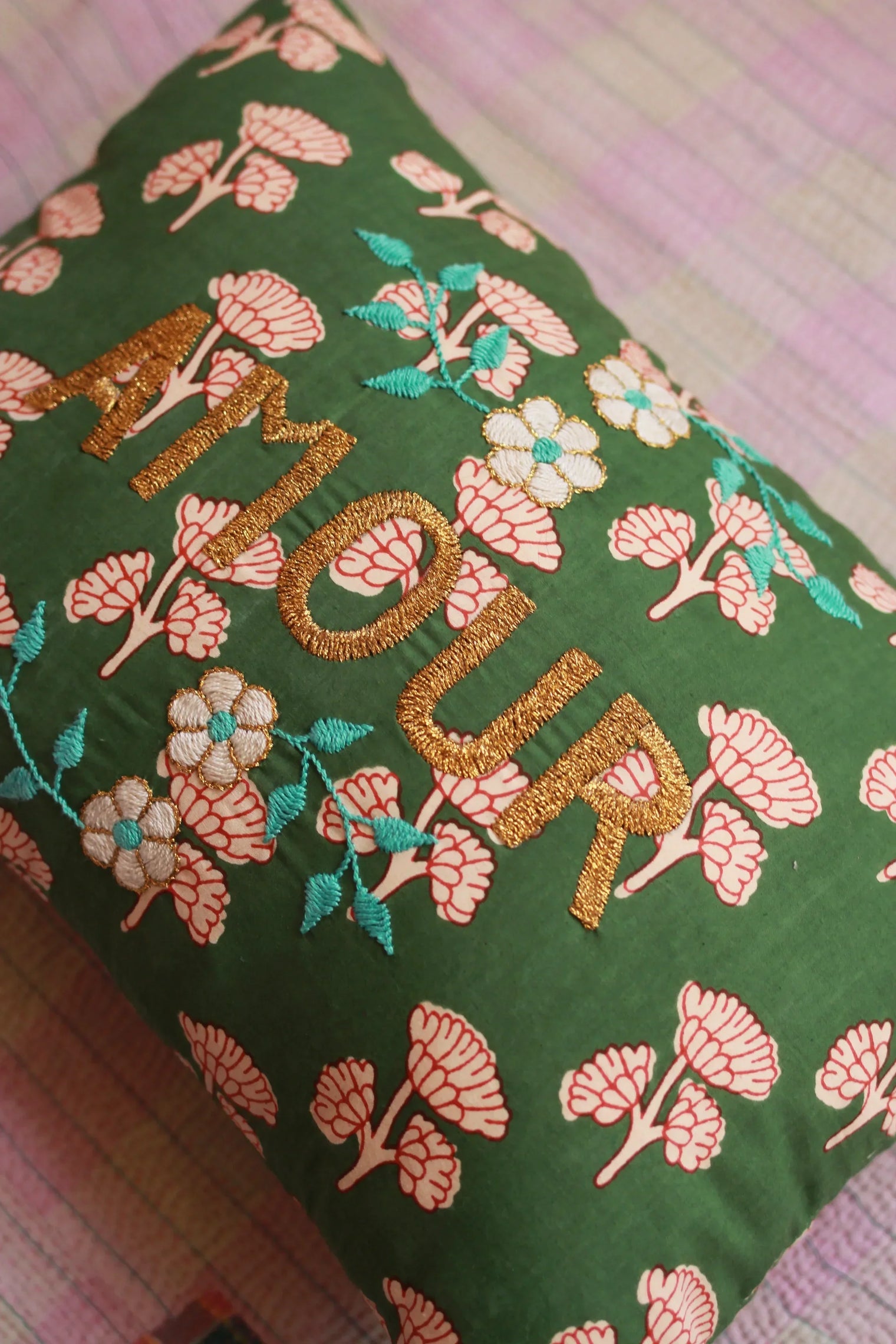 Green floral embroidered cushion with gold 'AMOUR' text, decorative home linen