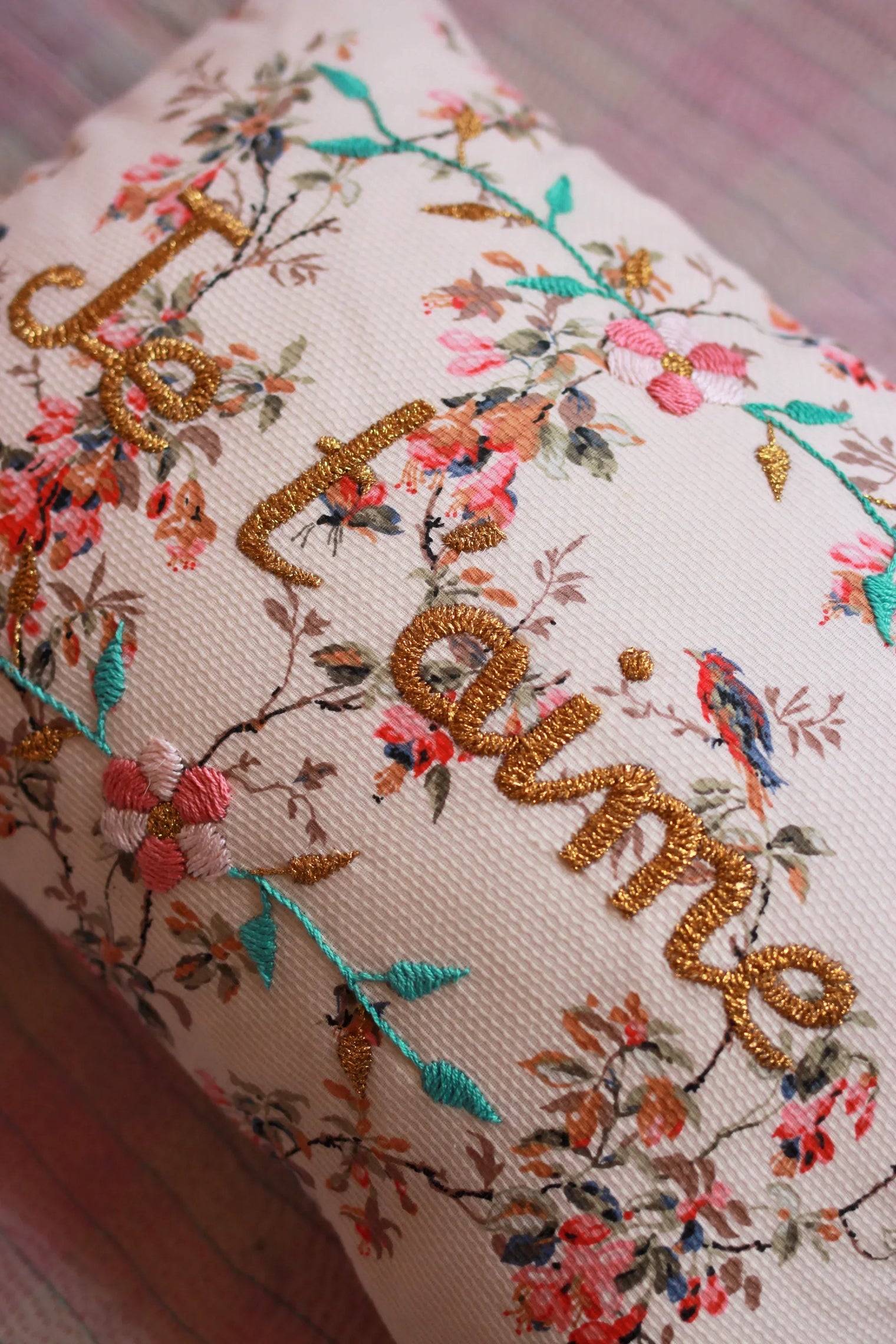 Decorative cushion with floral embroidery, gold 'I love you' text, bird and flower detailing