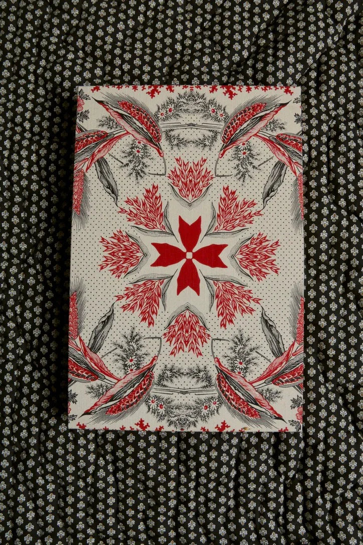Decorative box with red floral and bird pattern on black and white flower print fabric