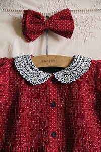 Red polka dot tunic and matching hair clip