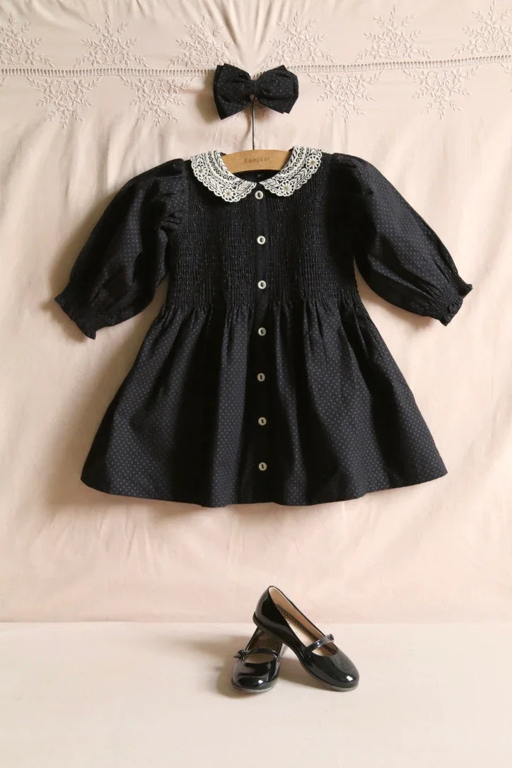 Black polka dot tunic and matching hair clip