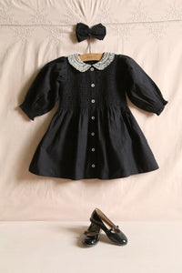 Black polka dot tunic and matching hair clip