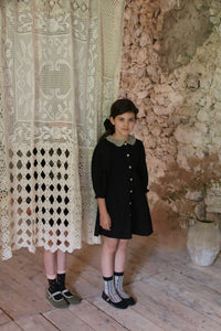 Black polka dot tunic and matching hair clip