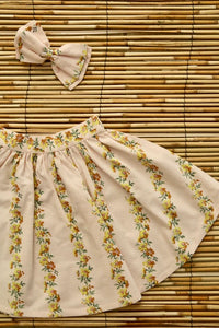 Jupe farandole de fleurs et barrette noeud pour les cheveux