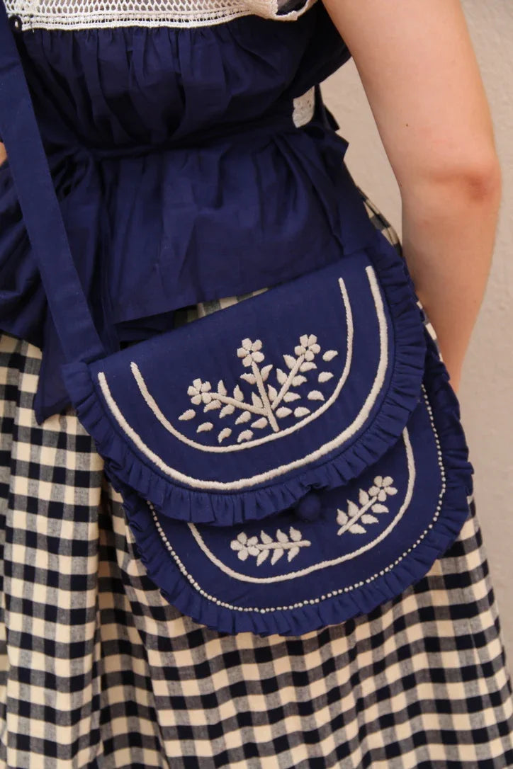 embroidered navy denim clutch bag