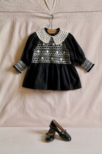 Blouse with black polka dot smocking and removable crochet collar