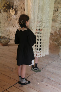 Black polka dot tunic and matching hair clip