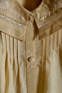 Butter-colored blouse with embroidered sailor collar
