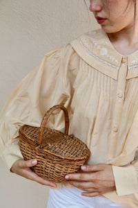 Butter-colored blouse with embroidered sailor collar