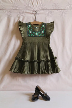 Olive green pleated girls dress with floral embroidery, ruffle sleeves, and black Mary Jane shoes