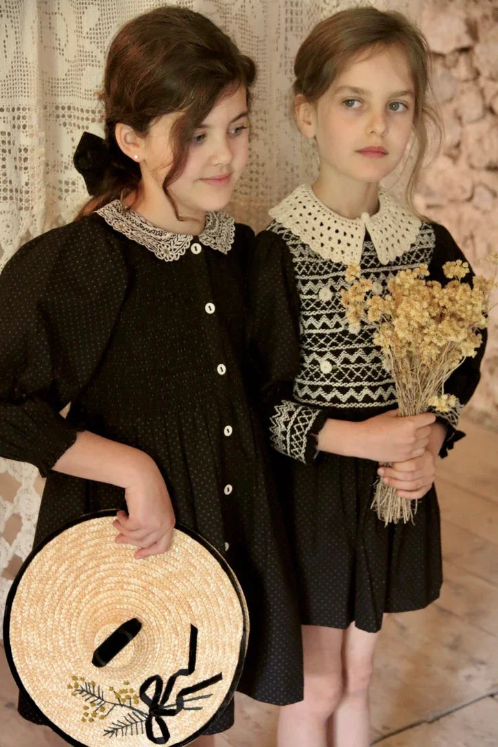 Black polka dot tunic and matching hair clip