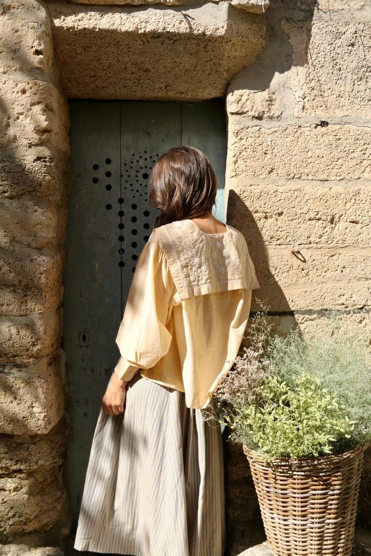 Butter-colored blouse with embroidered sailor collar