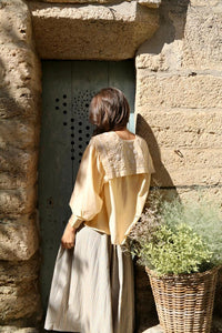 Butter-colored blouse with embroidered sailor collar