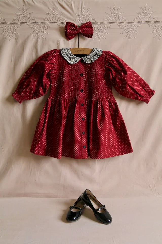 Red polka dot tunic and matching hair clip